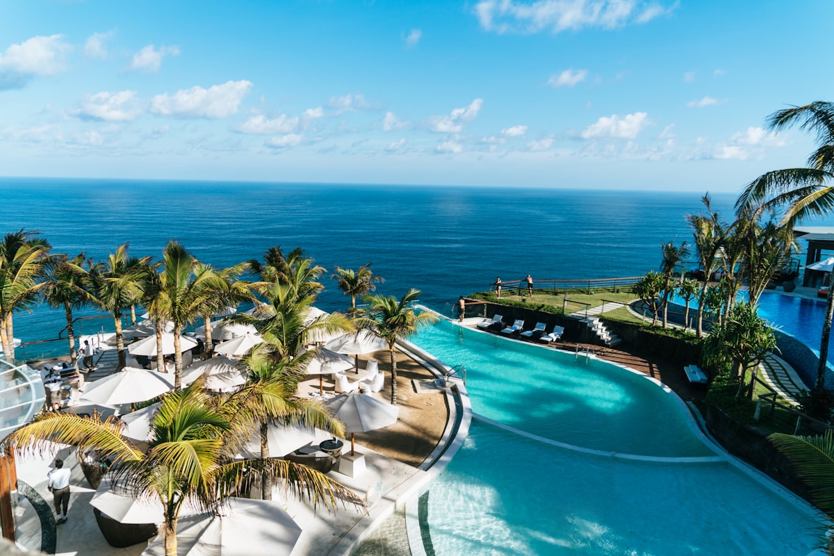 Guest enjoying an oceanside infinity pool