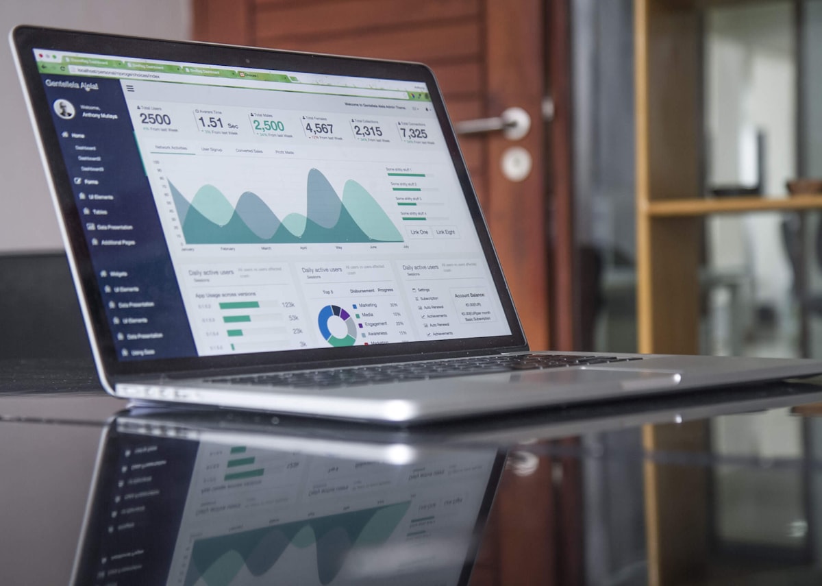 Laptop displaying booking analytics and revenue data